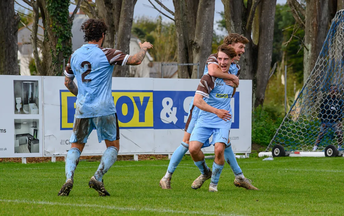 Tyrese Kelly celebrates his equaliser in normal time with Auryn Le Tissier and Tom de la Mare (No 2). (Picture by Andrew Le Poidevin, 33680311)