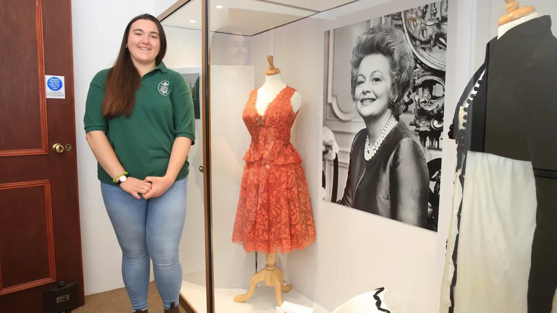 Guernsey Folk & Costume Museum manager Merrie Jee with Olivia De Havilland’s dresses and photographs. (Picture by Adrian Miller, 28555218)