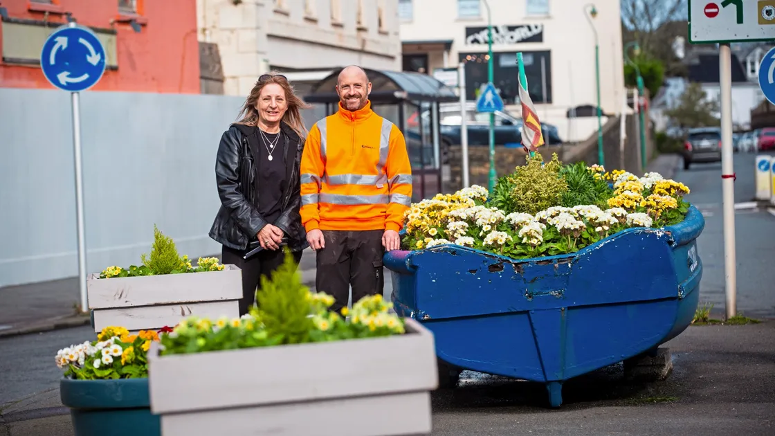 Bernie Coutu has been leading a campaign to tidy up the Bridge and has arranged for planters, some made by prisoners, to be installed. She is pictured with Darren Lilley of the States Works’ land management team, who planted the flowers. (Picture by Peter Frankland, 32968571)