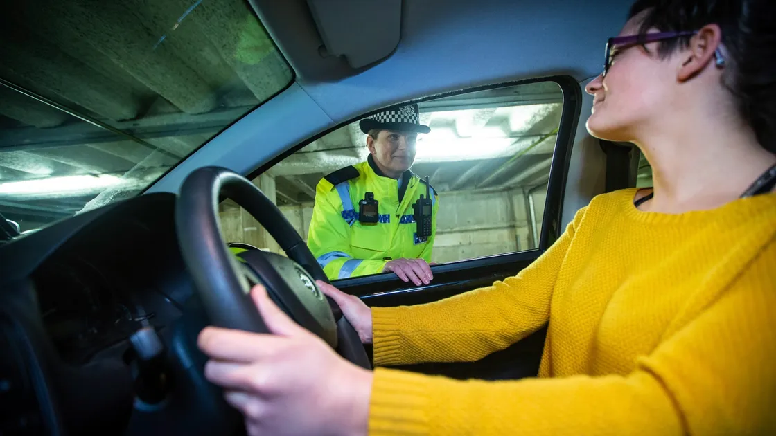 Student officer Jeanine Taylor pulls over Guernsey Press reporter Emily Hubert in a drink-drive test training exercise. (Picture by Peter Frankland, 29026644)