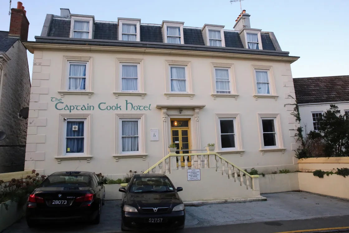 The former Captain Cook Hotel at 57, Hauteville, pictured in its latter days of operation as a hotel. It now stands empty and in a state of disrepair behind fencing.