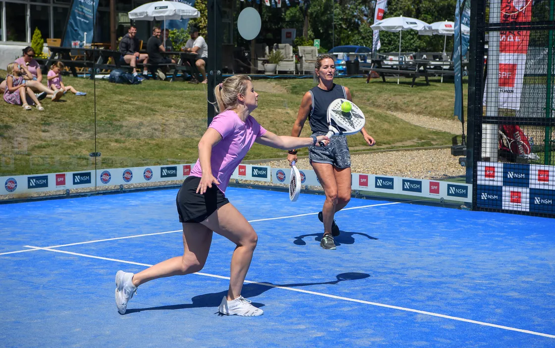Sophie Bray hits a volley watched by playing partner Daisy Dickson.