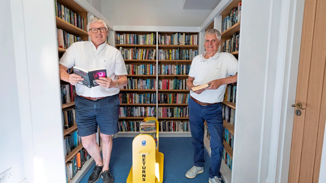 Dave Beausire and Rob Prow in the library which has moved to inside the office