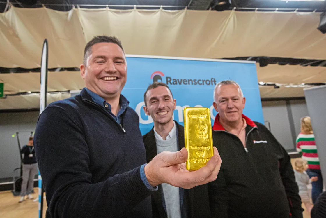 Stewart Moyles, left, of Ravenscroft’s precious metals team, hoped show attendees would remember what the company does, the gold bar being a reminder. He is with sustainability analyst Alex Rich, centre, and Jason Shambrook, head of HR. (Picture by Luke Le Prevost, 32782545)