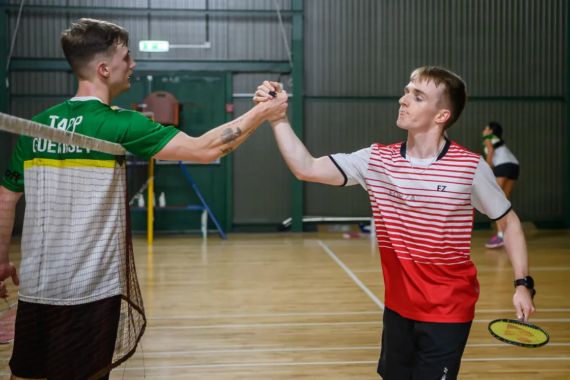 Champion Alex Tapp, left, and runner-up David Trebert shake hands after the open singles final. They went on to join forces to win the doubles. (Picture by Andrew Le Poidevin, 33830961)