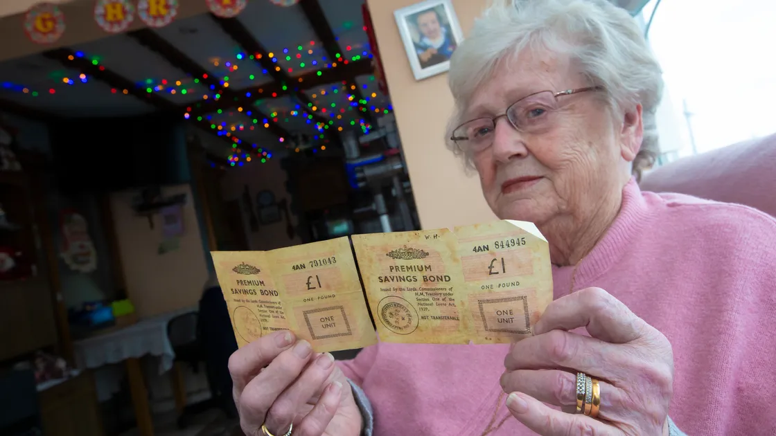 Mavis Legg with the vintage Premium Bonds which she remembers her father buying, but which was not registered in his name, but in the name of her mother-in-law. (Picture by Peter Frankland, 31582651)