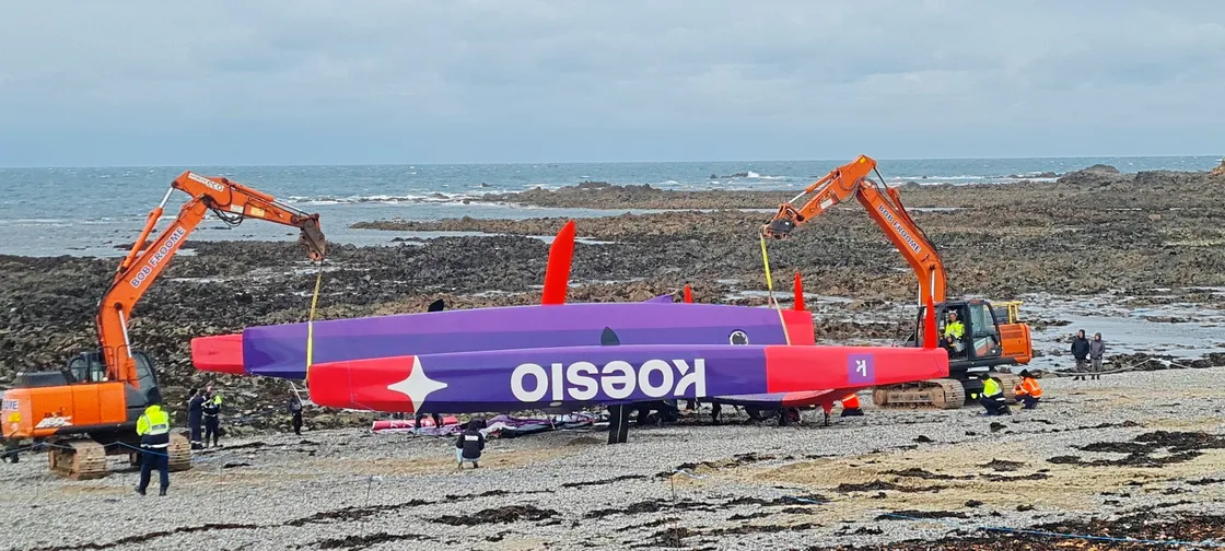 Diggers were used to move the 3.5 tonne trimaran above the high water mark on Sunday afternoon