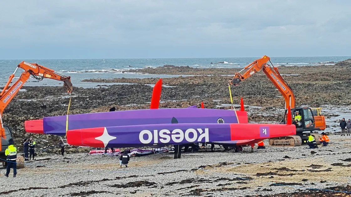 Diggers were used to move the 3.5 tonne trimaran above the high water mark on Sunday afternoon