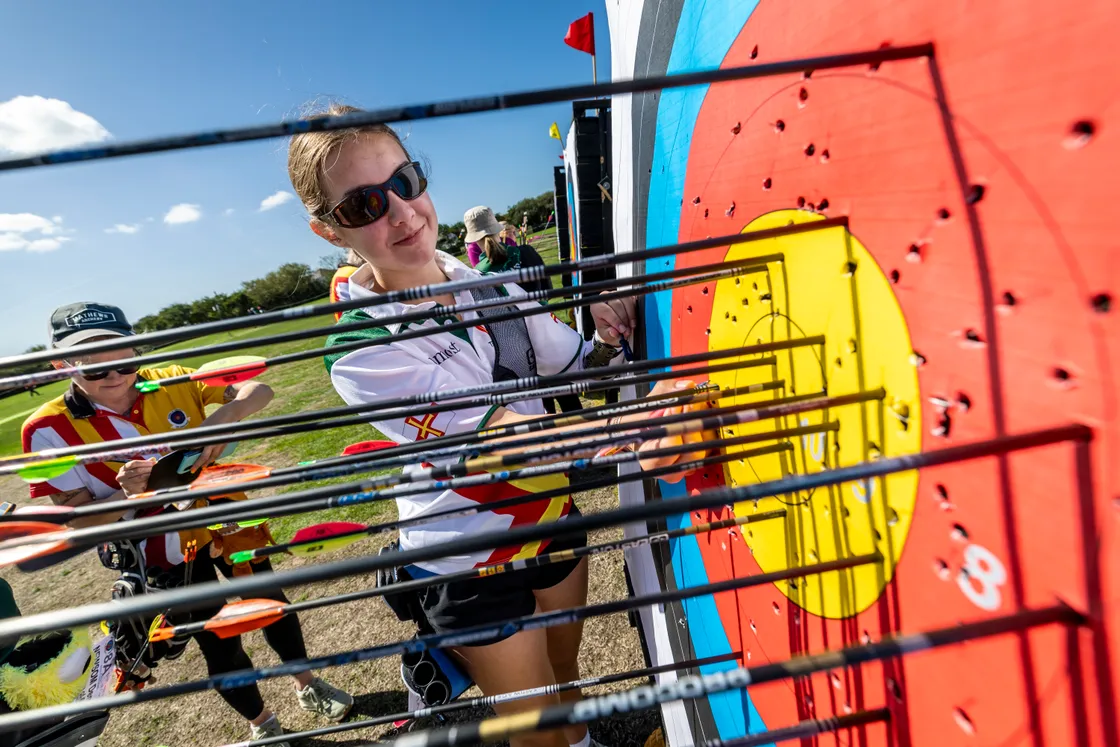 Guernsey archer Lily Hurrell inspects the scores at the target.