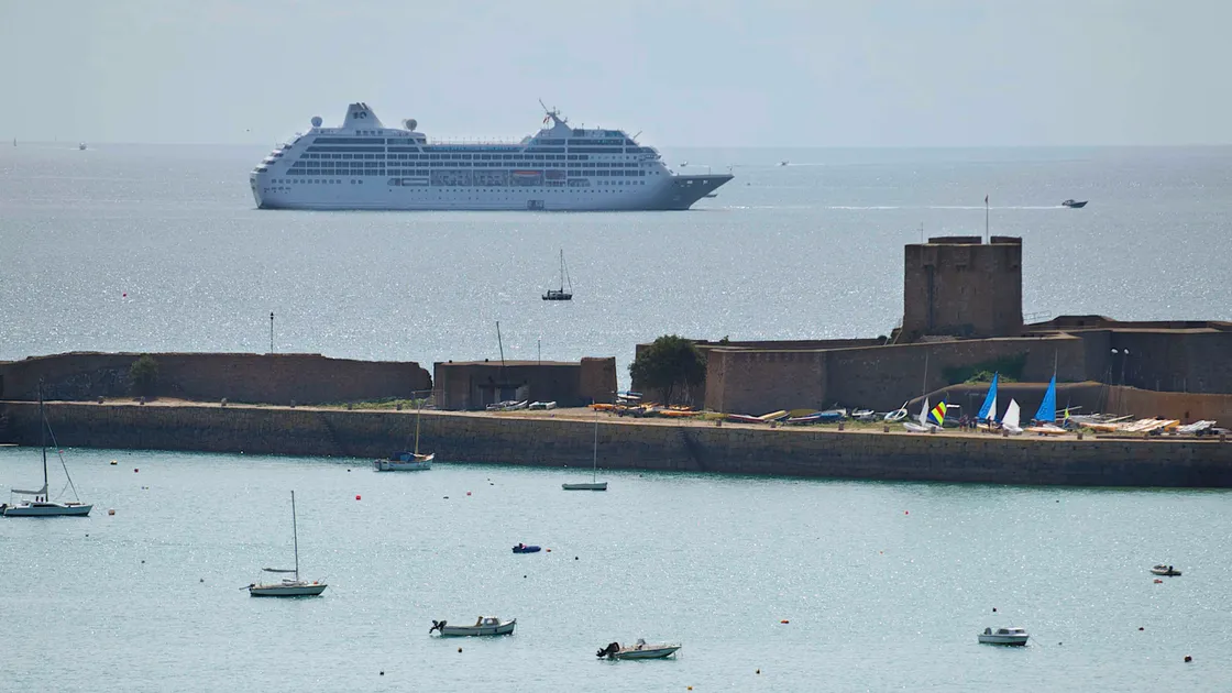 Cruise ship in St Aubin's Bay with St Aubin's Fort in the foreground 