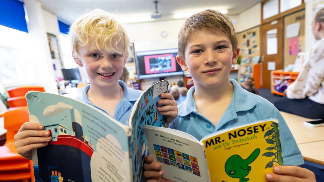 La Mare de Carteret Primary pupils Gabriel Taylor-Kerr, left, and Jackson Howitt, both 6. The school took part in Take 10 to Read's Guinness World Record attempt for the most people reading online in 12 hours. (Picture by Peter Frankland, 34969917)