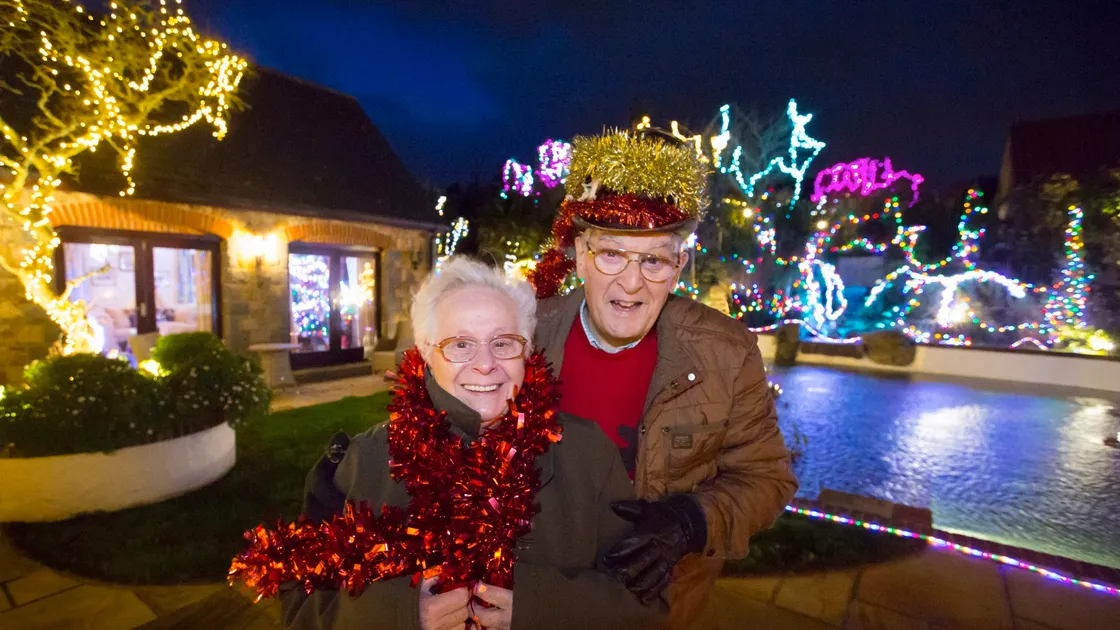 Roy and Maddie Sarre want to keep the Christmas spirit and feeling of hope at emerging from the pandemic going beyond Twelfth Night and are suggesting that islanders keep their outdoor lights up and switched on as many did with flags and bunting in May to mark 75 years of Liberation. (Picture by Adrian Miller, 29054830)