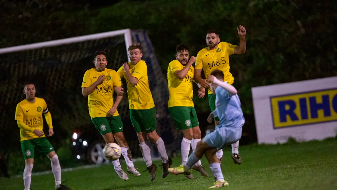 The Vale Rec wall jump in unison in an attempt to block a North free-kick in the Guernsey FA Cup. (Picture by Sophie Rabey, 31434181)