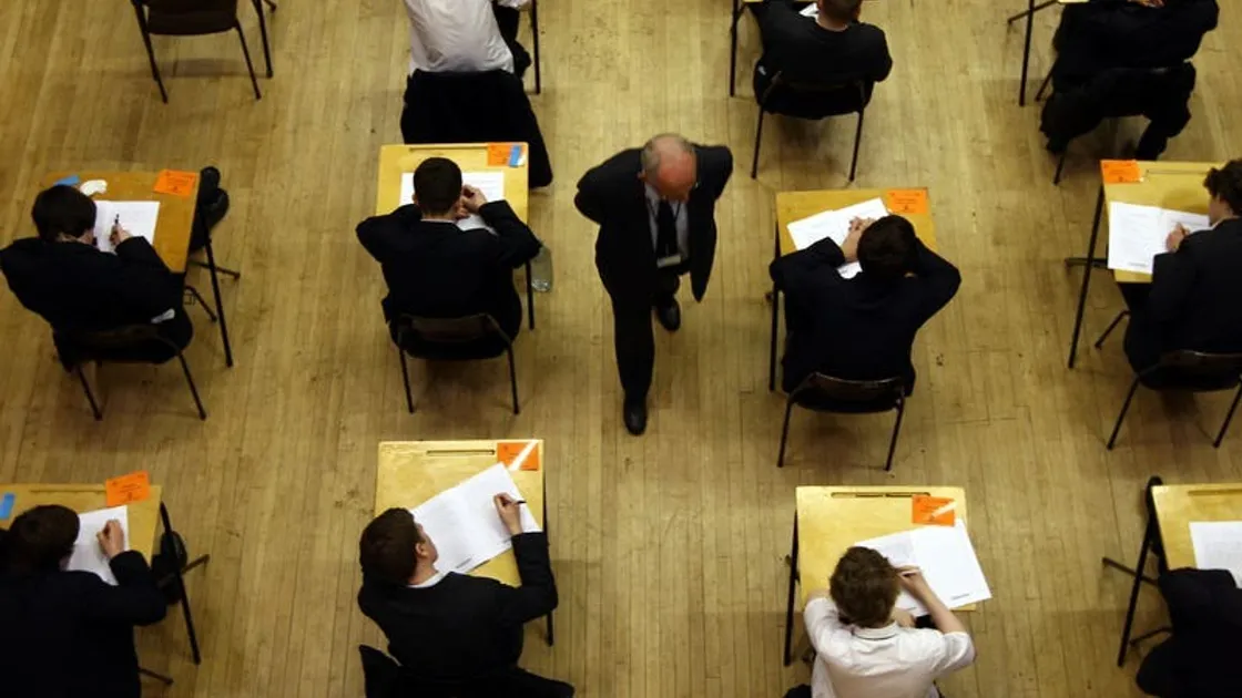 )File picture of UK pupils sitting an exam by David Jones/PA)