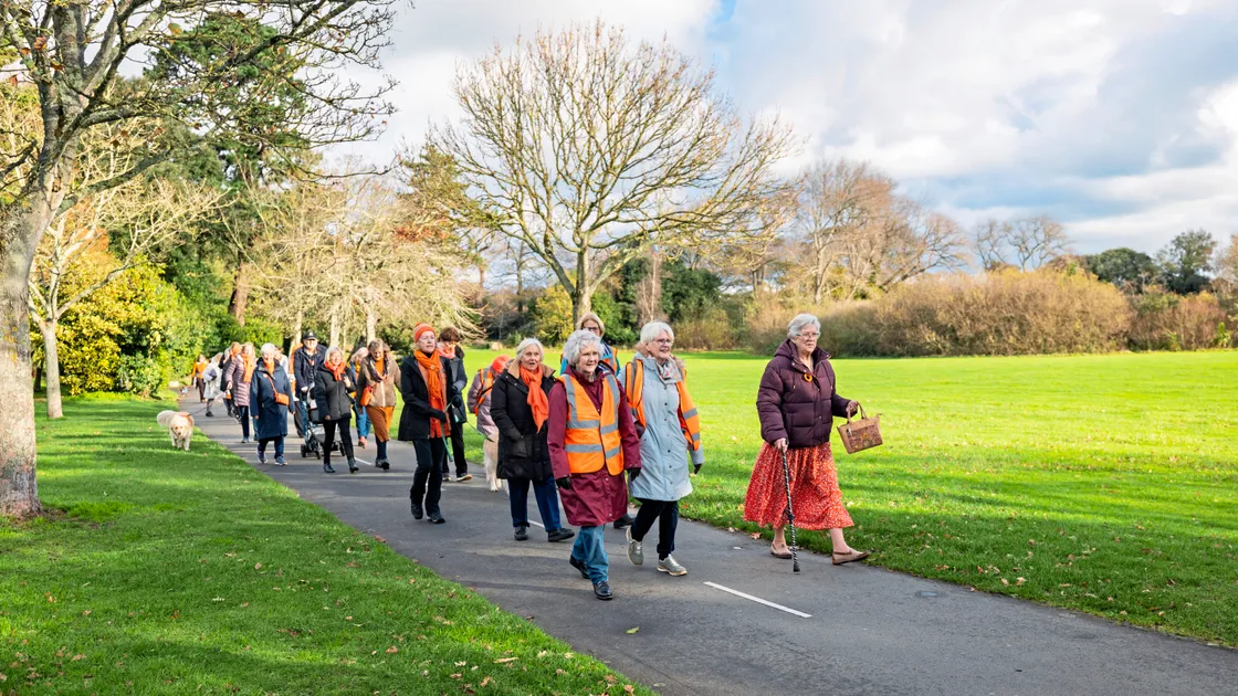 Yesterday more than 30 women walked through Saumarez Park, bedecked in the campaign’s signature orange