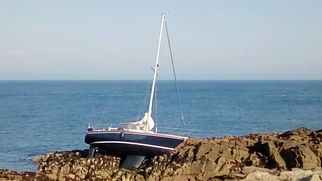 Greg Richardson took the picture of the yacht on the rocks. It was floated off on the next high tide.