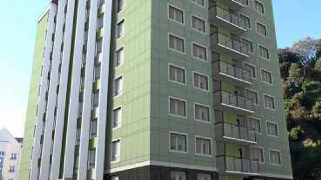 An impression of what the south elevation of a refurbished Cour du Parc will look like. The plans submitted to Environment include cladding the building with rain screen to eradicate condensation problems and also to improve its appearance.