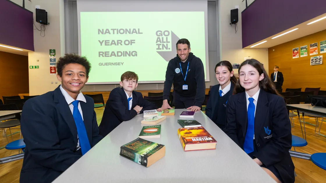 Guernsey FC footballer Ross Allen visited Les Beaucamps High School to share his love of books and champion the importance of reading for pleasure. Pupils, left to right, Sanna Clarke, Alfie Marquand, Tiana Crowson and Masie Bougourd. (Picture by Sophie Rabey, 34643145)