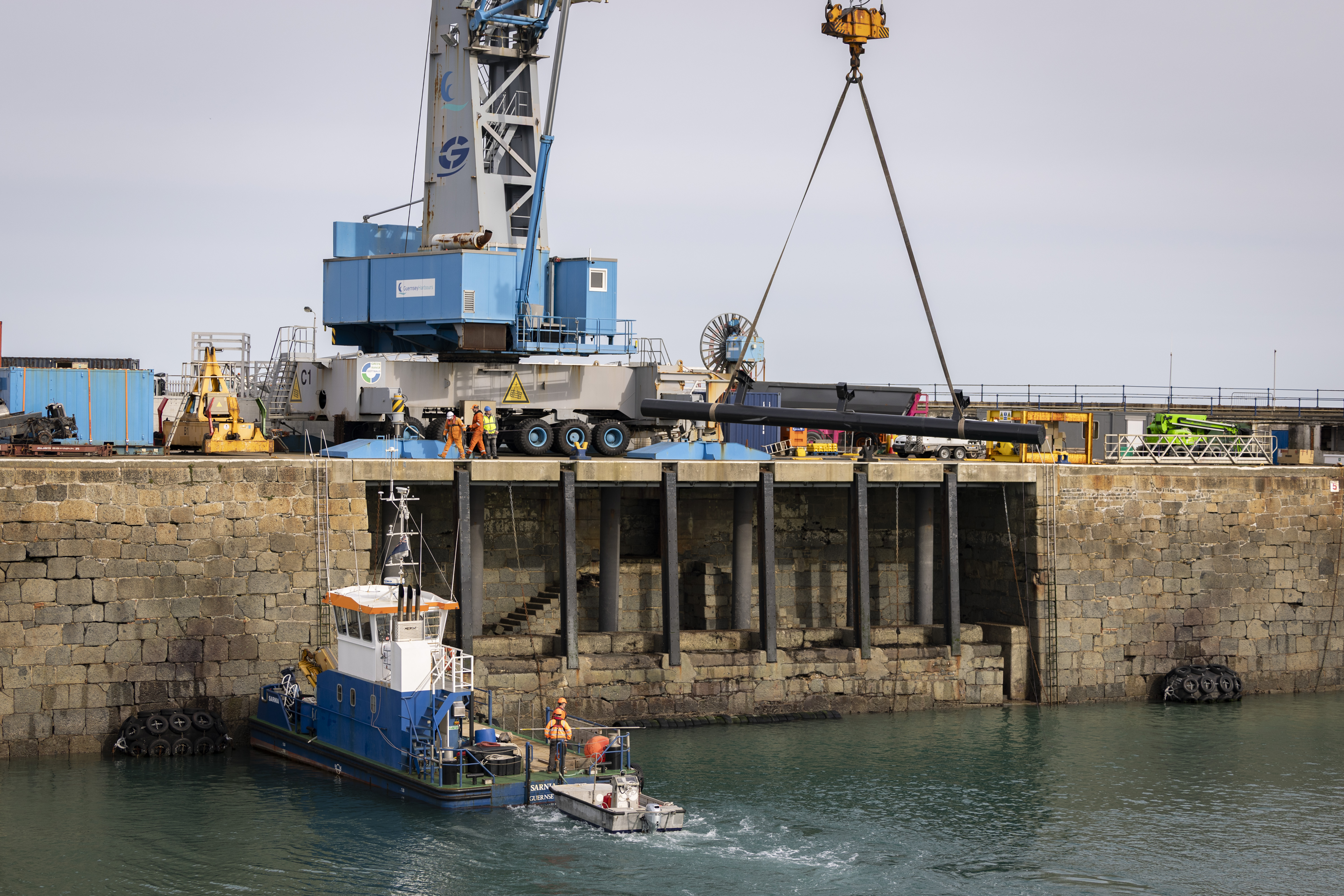 Refurbished piles craned back into place at harbour