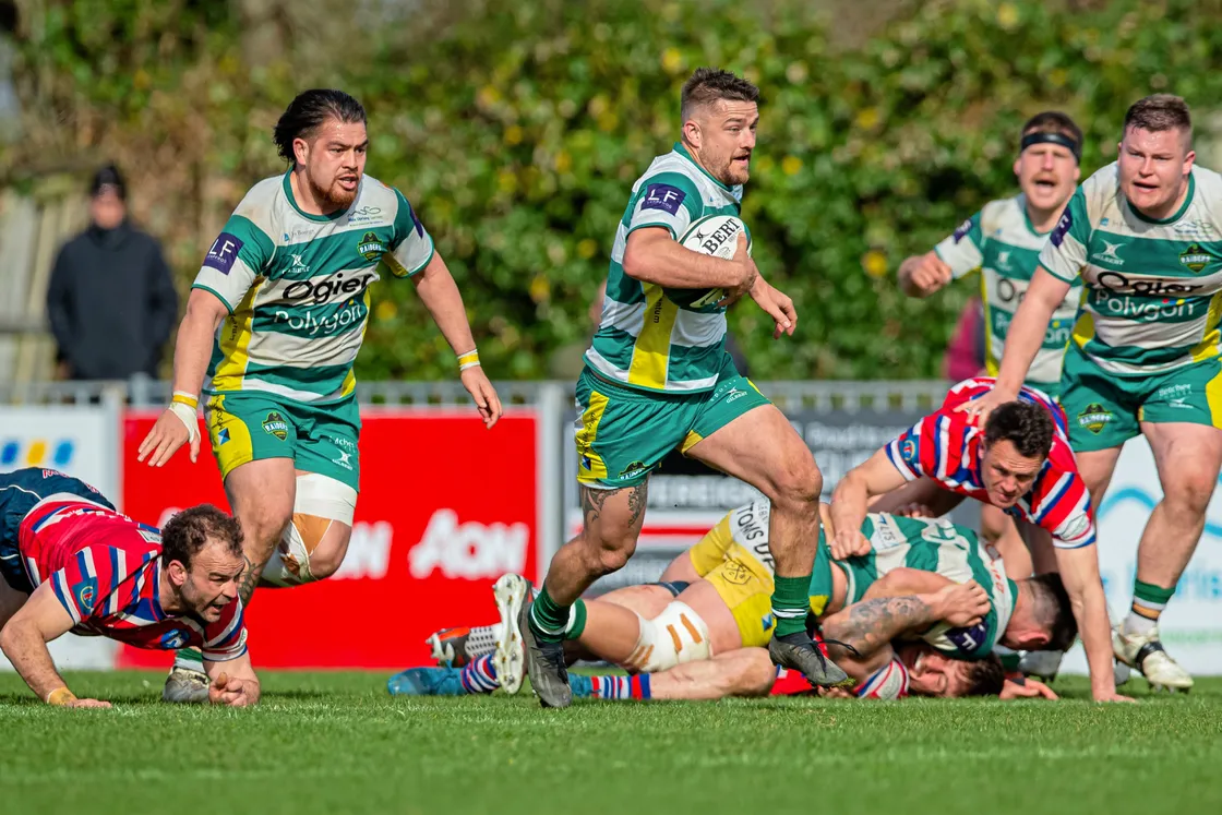 Dale Rutledge powers forward in the closing minutes as Raiders chase the game.