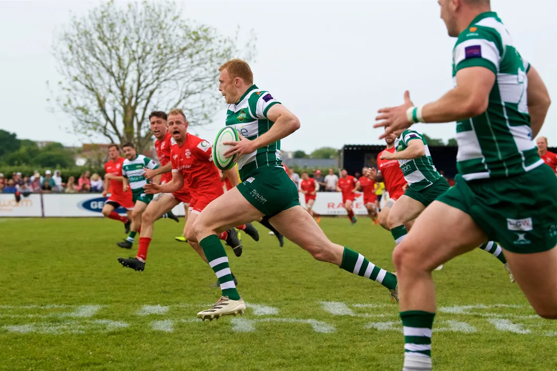Rugby at St Peter. Siam Cup. Jersey Reds Athletic (red) V Guernsey Raiders (green)...Anthony Armstrong received the Engleman Trophy for man of the match.                                                             Picture: ROB CURRIE. (31617362)