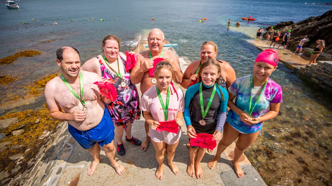 Left to right, Jason Gallienne, Annette Gallienne, Shaun Leech, Chloe Brache, 15, Claire Stanbury, Olivia Stanbury, 11, and Katherine Brache, 12, at the BWCI Open Castle Charity Swim. The group completing the swim on Shaun’s birthday. (Pictures by Sophie Rabey, 31170874)