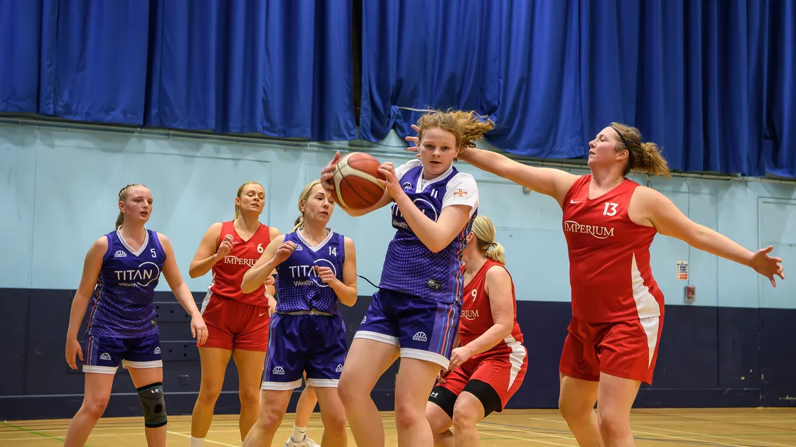 Titans duo Daisy Burrows, in possession, and Florrie Cooper, far left, will make their Guernsey debuts.