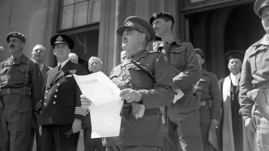 Brigadier Alfred Snow reading the proclamation of King George VI, restoring the King’s rule and establishing his role as military commander of the Channel Islands on the steps of Elizabeth College in May 1945. 						 (Picture: Muggeridge, Daily Sketch)