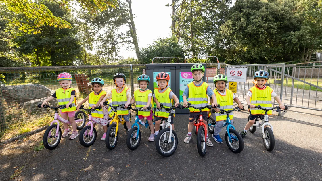 Young cyclists on balance bikes at Beau Sejour in front of the bike storage shed that was damaged at the weekend.  					 					 (Picture by Sophie Rabey, 34856508)