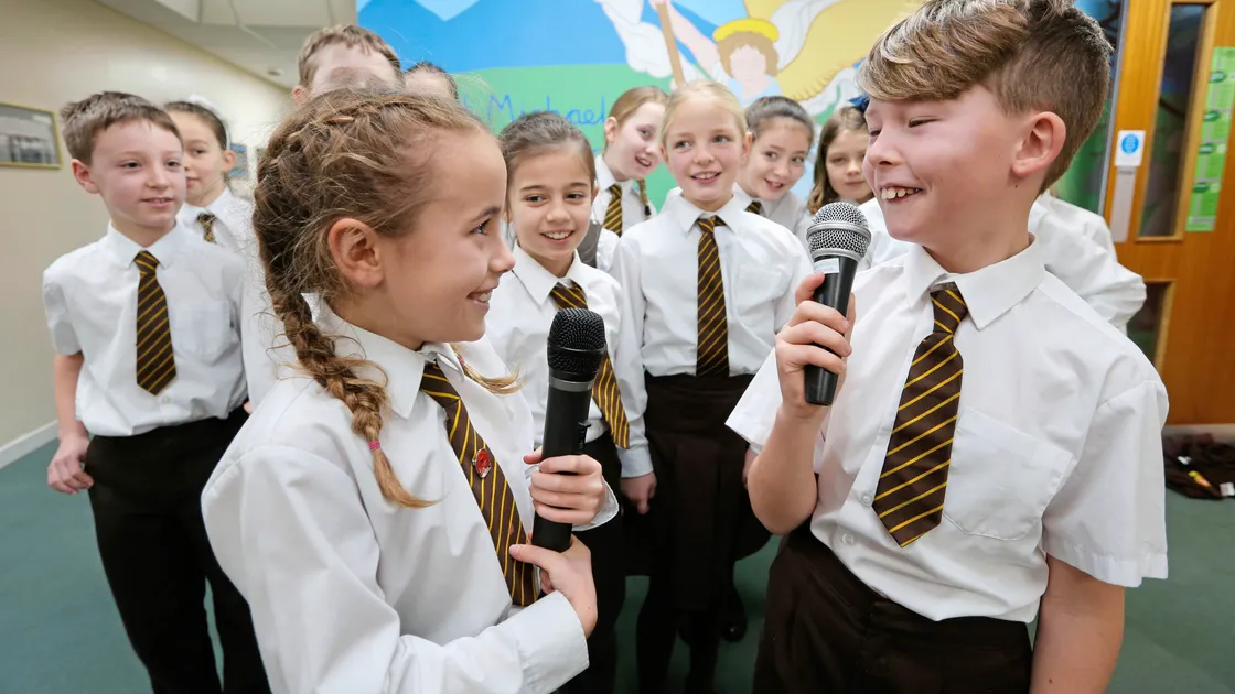 The school choir are taking part in national choir event called Young Voices at the O2 Arena in London. Nearest the camera are, left, Alix Le Noury, 8, and Eoin Fleming, 9. (Picture by Adrian Miller, 20535511)