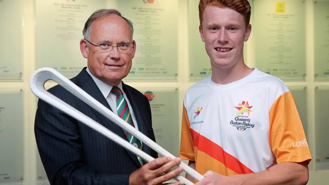 Bailiff Sir Richard Collas receives the Queen’s Baton from athlete Alastair Chalmers, Youth Commonwealth gold medallist. (Picture by Adrian Miller 19276512)