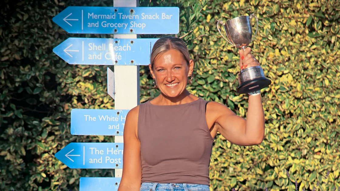 Women’s winner Nora Le Tissier with the trophy.