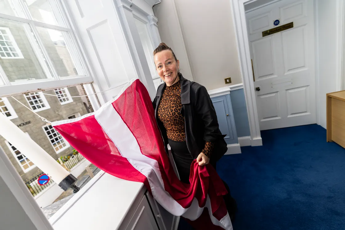 Evita raised the Latvian flag at St Peter Port Parish Constables’ Office to celebrate Latvia’s Proclamation Day last year.