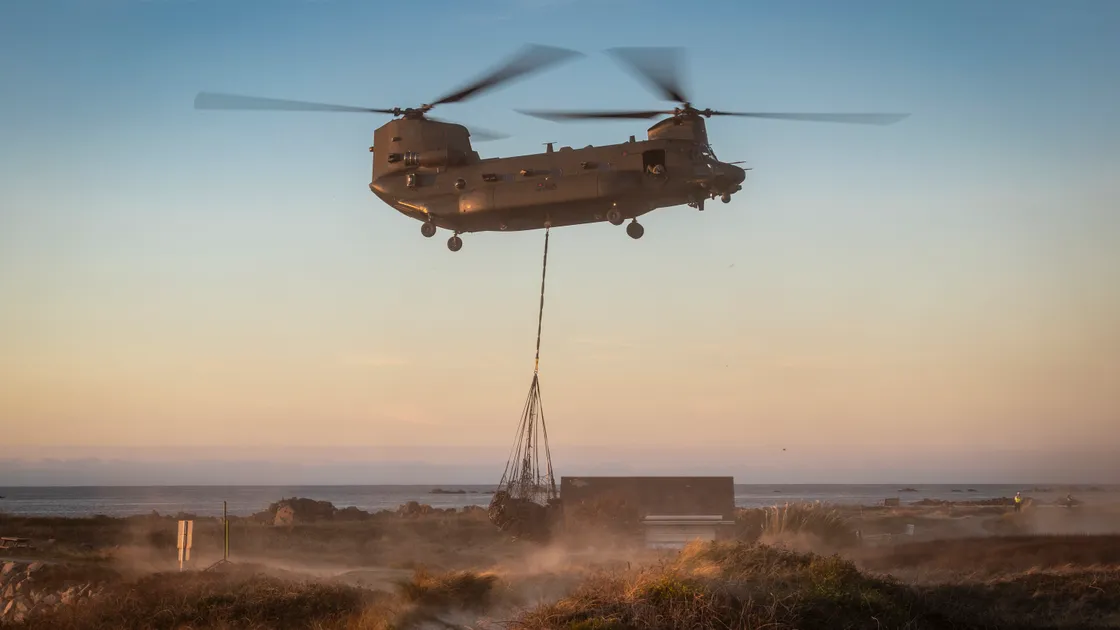 An RAF Chinook helicopter carries a car, found at the bottom of cliffs in Alderney, to Port Soif where it was collected by a recovery vehicle and taken away for forensic analysis.