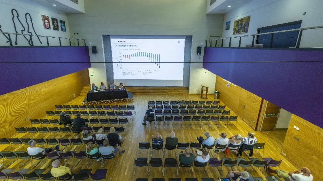 There were plenty of empty seats in Les Beaucamps High School hall for the event.