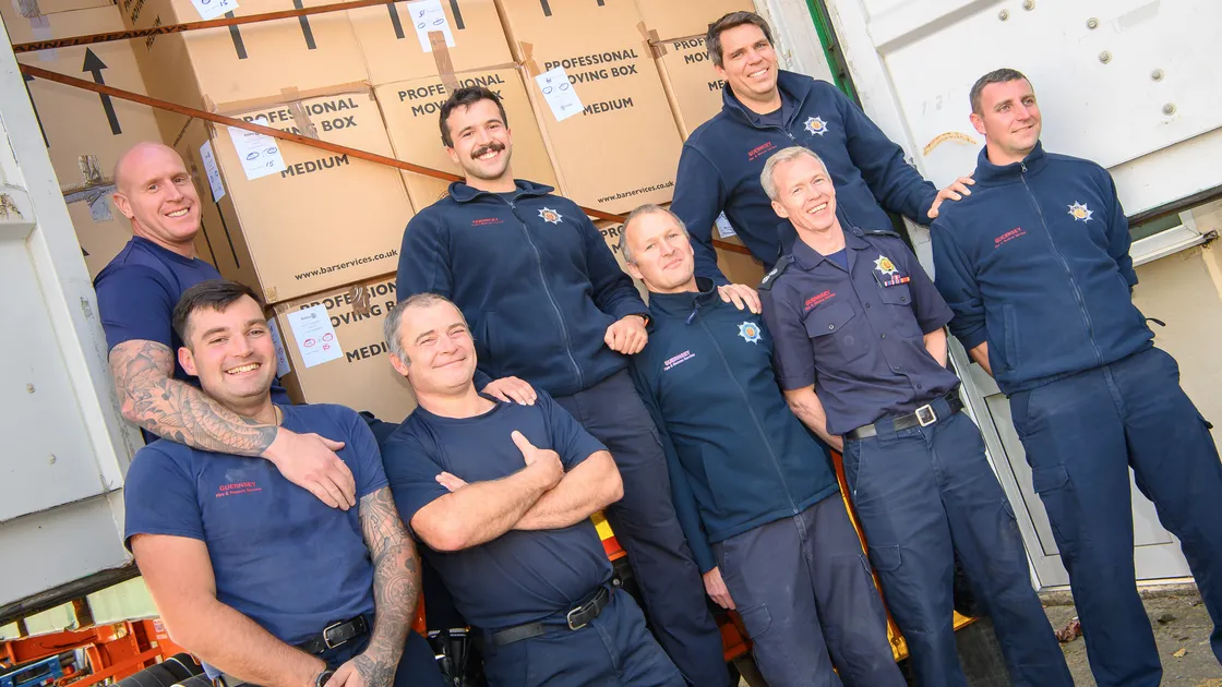 Members of the Fire & Rescue Service helped with the packing and loading of the Rotary Club Christmas gift shoeboxes