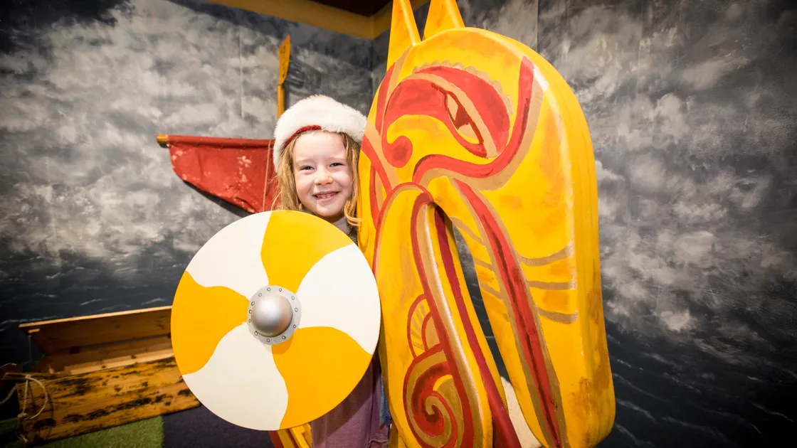 Six-year-old Emma C on the new Viking ship at Guernsey Museum which has opened for the first time this year. (Picture by Adrian Miller, 29398885)