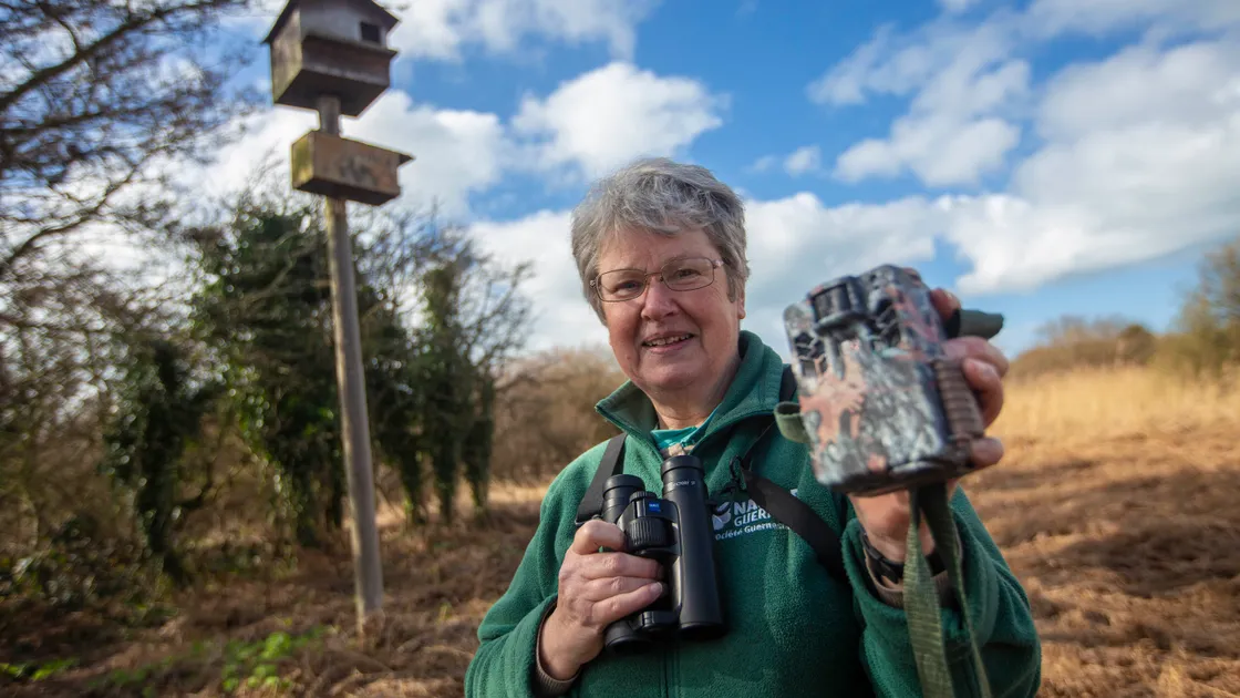 Julie Davis, who presented her barn owl survey report to La Societe’s AGM last night. Behind her at Le Grand Pre nature reserve is one of the nesting boxes it is looking to replace in a partnership with Grow. (Picture by Peter Frankland, 31918323)
