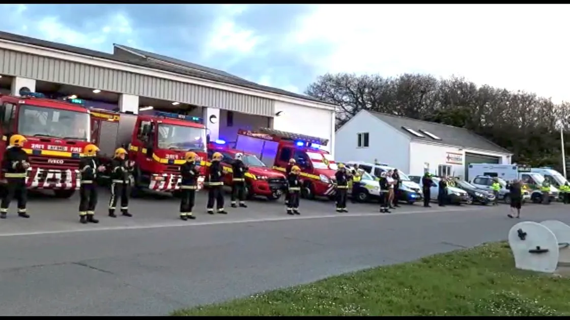 A gathering of the Alderney Fire Brigade, Ambulance, Police, Doctors, Borderforce and Harbour Office clapping for carers. (28042918)