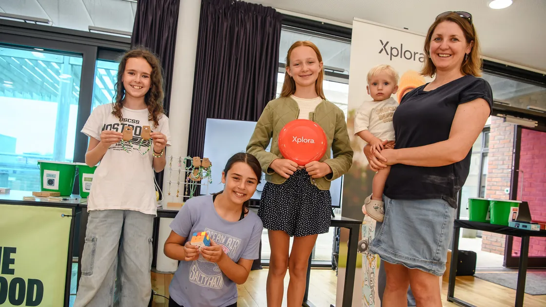 Left to right: Robin Archer, Rosie Smith and Ella Dowling hold items that they can use to fill the time they gain by not using a mobile phone. Zoe Way attended the talk with her 14-month-old son Thomas.