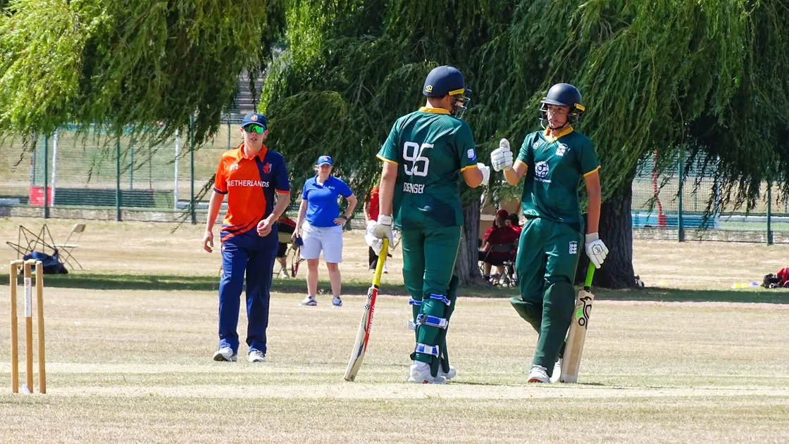 Barney Groves (95) and Oscar Lewis batting against the Netherlands.