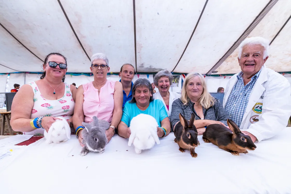Rabbit enthusiasm in the Fur and Feather tent, with, from left to right, (front) Hayley Correia, Allison Brouard, Susan Richards, judge Ann Le Page and Ken Falla. Back, left to right, Leah Peck and Audrey Falla.