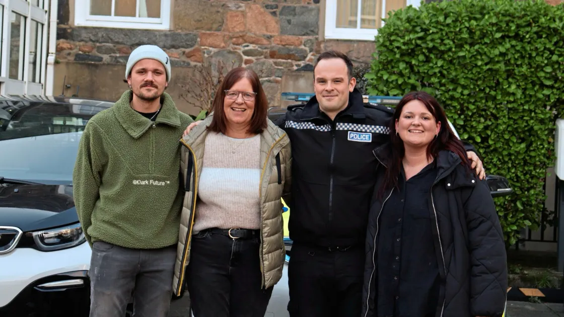 Tina Collenette, second from left, who suffered a heart attack and cardiac arrest last September, is reunited with PC James De La Mare who helped to save her life while he was off duty. Also pictured are Mrs Collenette’s children Joe and Hannah. (34044972)