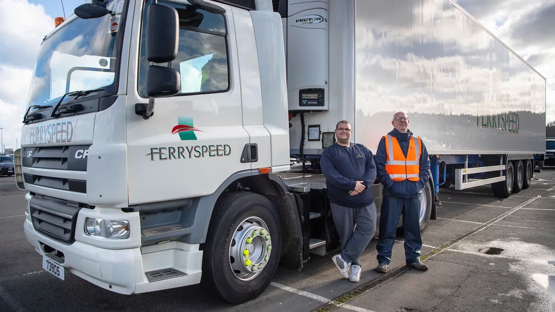 Dean Batiste, left, who is just completing his training to qualify him to drive this size of artic, with Shaun Staples, Ferryspeed’s training and safety officer. (Pictures by Andrew Le Poidevin)
