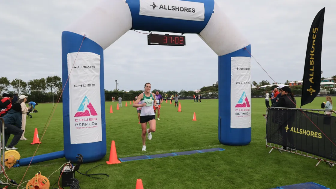 Nat Whitty crosses the line of the 10km in Bermuda with a new personal best