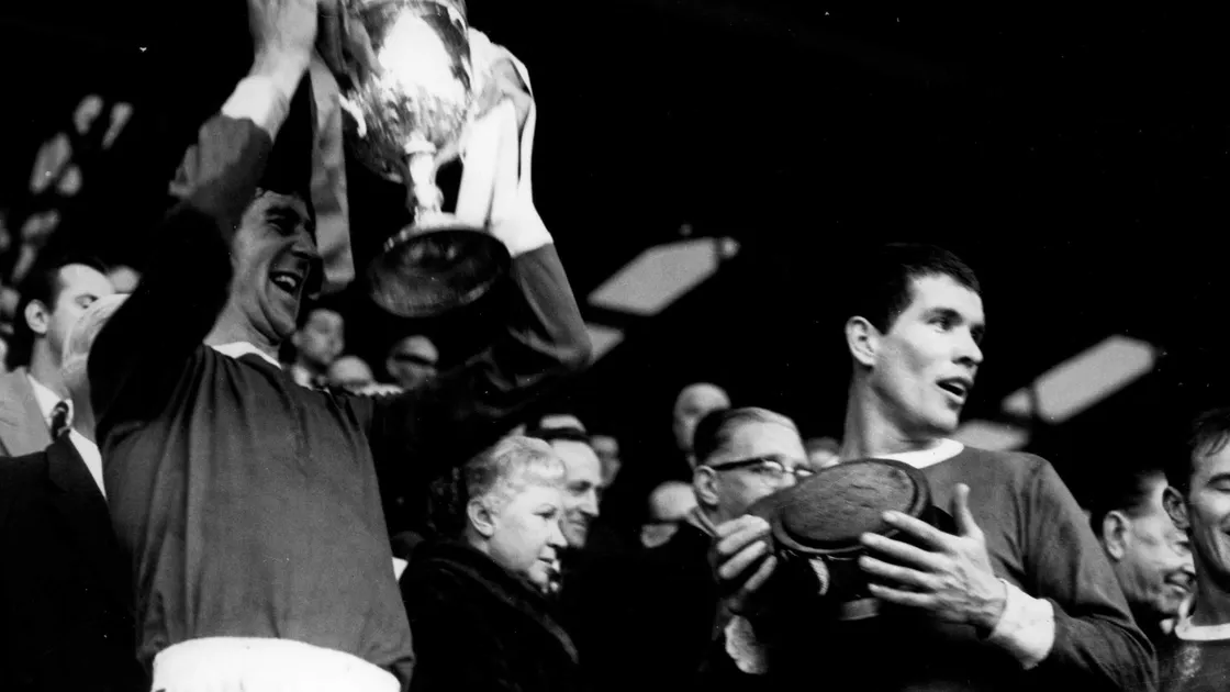 Fresh FA Amateur Cup winner Jim holds the base of the trophy having climbed the famous Wembley steps