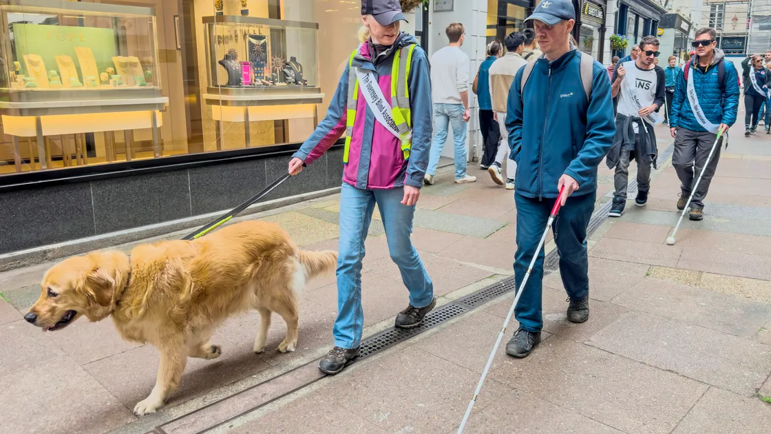Tina and Simon De La Mare with assistance dog Cyril