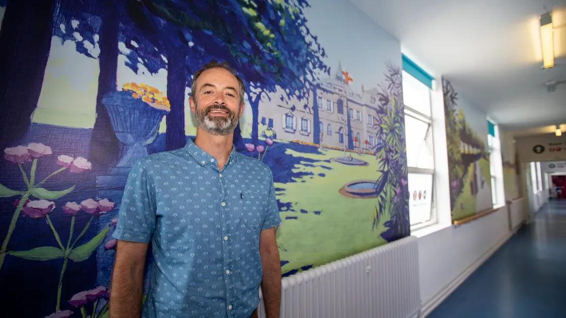 James Colmer’s mural of Saumarez Park not only brightens the corridor of De Sausmarez ward, the oldest at the Princess Elizabeth Hospital, but also gives staff another way of monitoring the distance orthopaedic patients have walked. (Picture by Luke Le Prevost, 31098888)