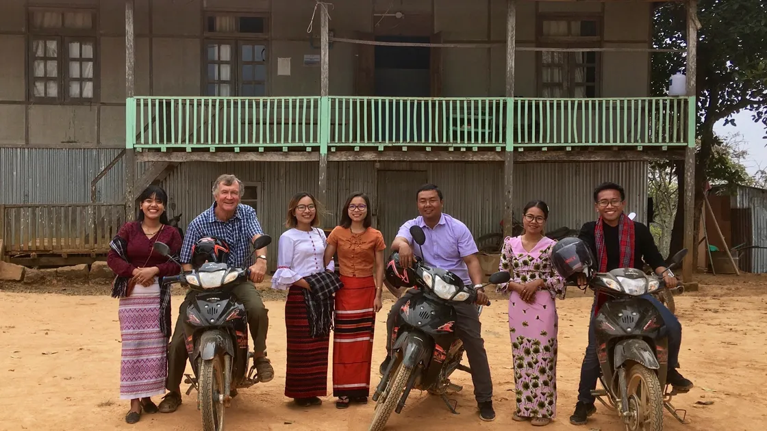 Dr Nick Paluch in front of a clinic built with money from Guernsey’s overseas aid budget with members of the local health team.
