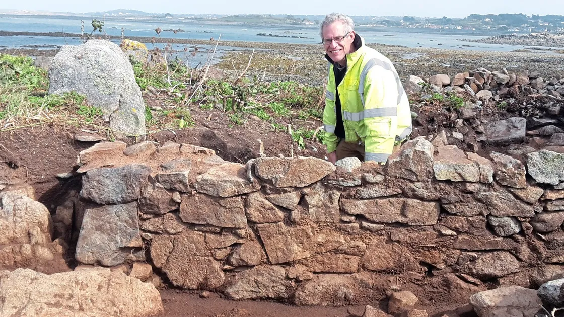 States archaeologist Phil de Jersey on Chapelle dom Hue, a tidal island off Perelle where the team digging there have uncovered the remains of a religious building.  	  	             (Picture by Juliet Pouteaux, 19291106) 